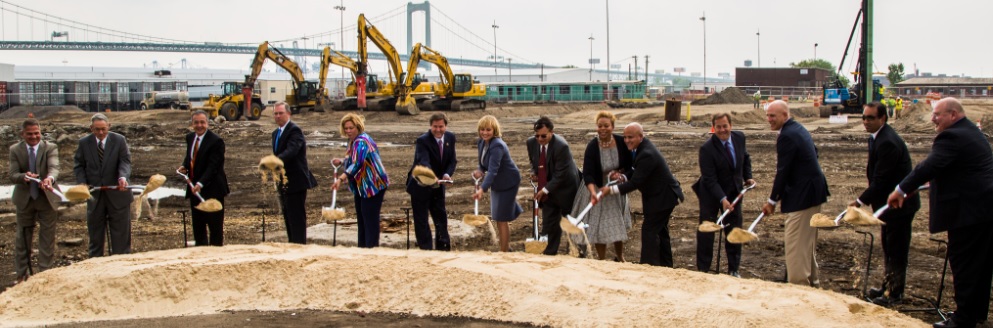 Groundbreaking Participants from left to right: Mr. Kevin Castagnola (Executive Director & CEO of SJ Port Corp.); Richard Alaimo (Chairman of SJ Port Corp.); Mr. Pierre Oneid (Senior V.P. and Chief Nuclear Officer of Holtec); Mr. William Levis (President & Chief Operating Officer of PSEG); NJ State Senator Nilsa Cruz-Perez; U.S. Congressman Donald Norcross; NJ Lt. Governor Kim Guadagno; Dr. Kris Singh (President & Chief Executive Officer of Holtec); Camden Mayor Dana Redd; Mr. Frank Moran (City of Camden Council President); Mr. Louis Cappelli (Camden County Freeholder Director); Mr. Joseph Jingoli (CEO of Joseph Jingoli & Son); Mr. PK Chaudhary (Holtec Senior V.P. of Operations); Mr. Allen Hickman (Holtec V.P. of Manufacturing and Supply)