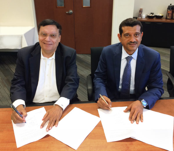 Dr. Kris Singh (Left) and Dr. Saeed Almutawa (Right) Sign the Joint Venture Agreement During the Holtec Advisory Council Meeting on August 3, 2016