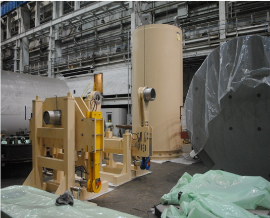 HI-TRAC 190 Transfer cask with the HI-TRAC lift yoke and HI-TRAC redundant lift yoke at the Holtec Manufacturing Division in Turtle Creek, PA.